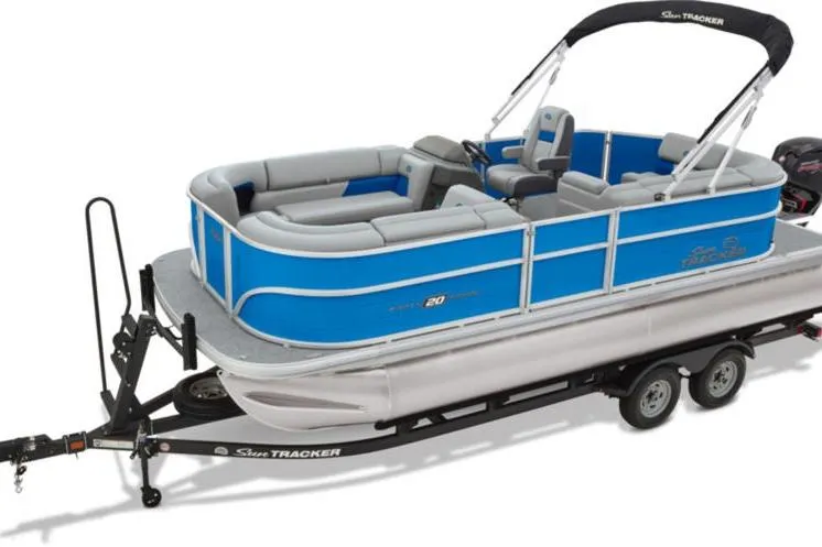 Slide: The Image of 2026 Sun Tracker Party Barge 20 DLX pontoon boat on trailer, blue and gray design. - 3