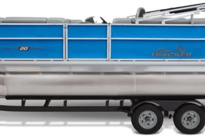 Slide: The Image of 2026 Sun Tracker Party Barge 20 DLX pontoon boat with blue panels on a trailer. - 4