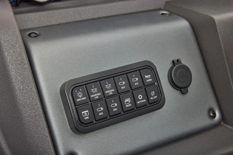 Slide: The Image of Control panel of 2026 Sun Tracker Party Barge 20 DLX with various switches. - 40