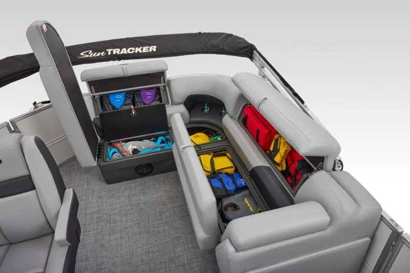 Slide: The Image of 2026 Sun Tracker Party Barge 20 DLX interior with ample storage and seating. - 43