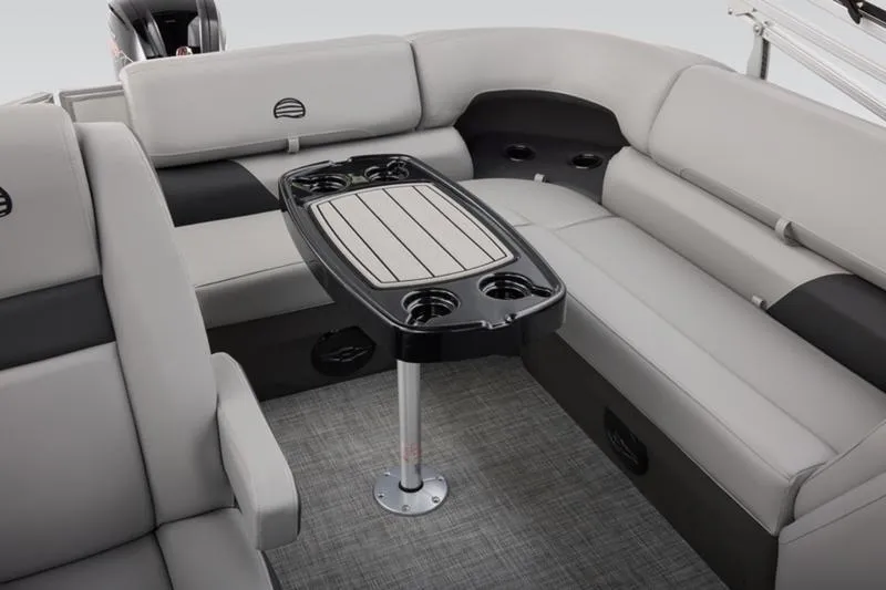 Slide: The Image of 2026 Sun Tracker Party Barge 20 DLX interior with seating and table. - 45