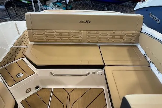 Slide: The Image of 2024 Sea Ray SPX 210 boat interior with tan seating and stylish design. - 14