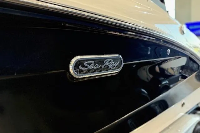 Slide: The Image of 2024 Sea Ray SPX 210 boat emblem on sleek black hull. - 3