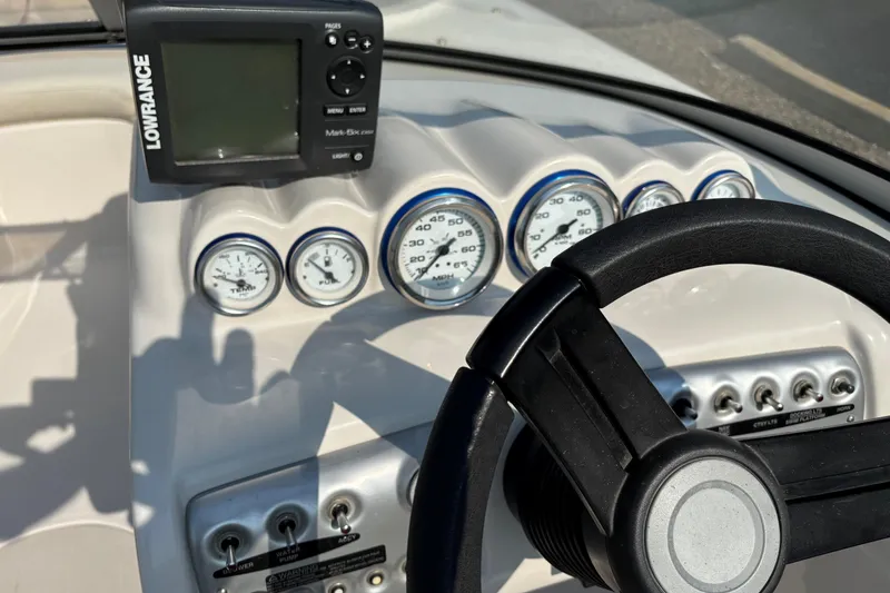 Slide: The Image of Dashboard of 2006 Starcraft C-Star 1800 I/O boat with gauges and Lowrance device. - 10