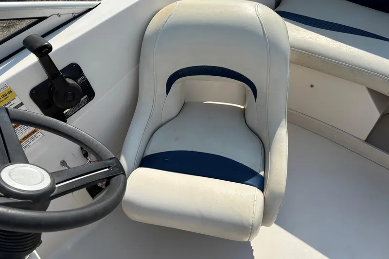 Slide: The Image of 2006 Starcraft C-Star 1800 I/O boat interior with steering wheel and seat. - 11