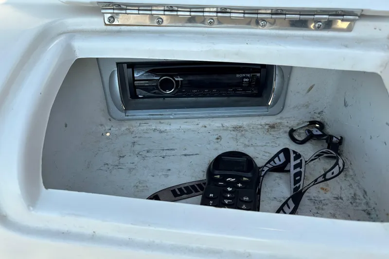 Slide: The Image of Storage compartment in a 2006 Starcraft C-Star 1800 I/O boat with a Sony stereo system. - 14