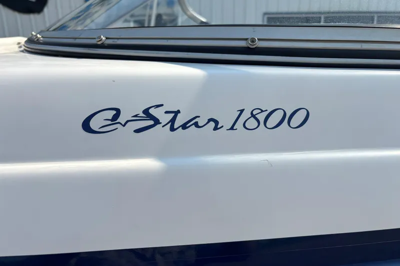 Slide: The Image of 2006 Starcraft C-Star 1800 I/O boat model name on white hull. - 17