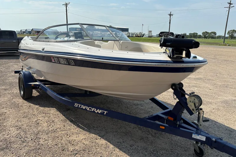 Slide: The Image of 2006 Starcraft C-Star 1800 I/O boat on trailer, parked outdoors. - 3
