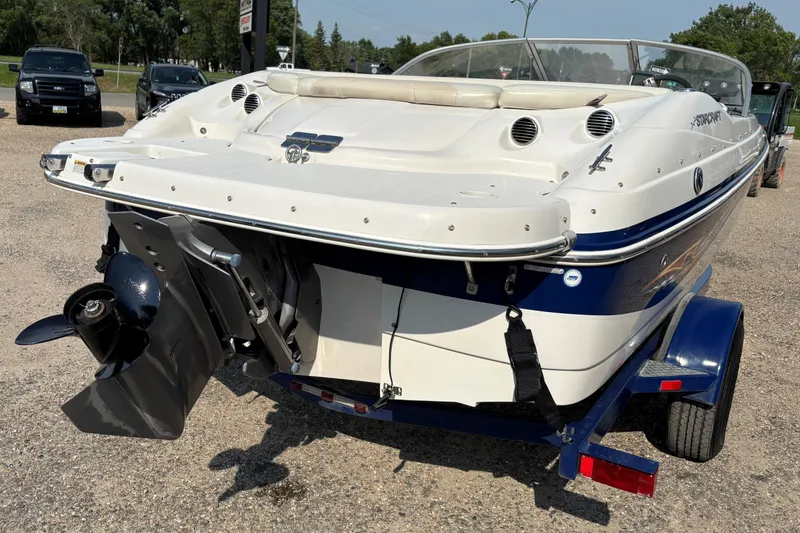 Slide: The Image of 2006 Starcraft C-Star 1800 I/O boat on trailer, rear view, outdoors. - 4