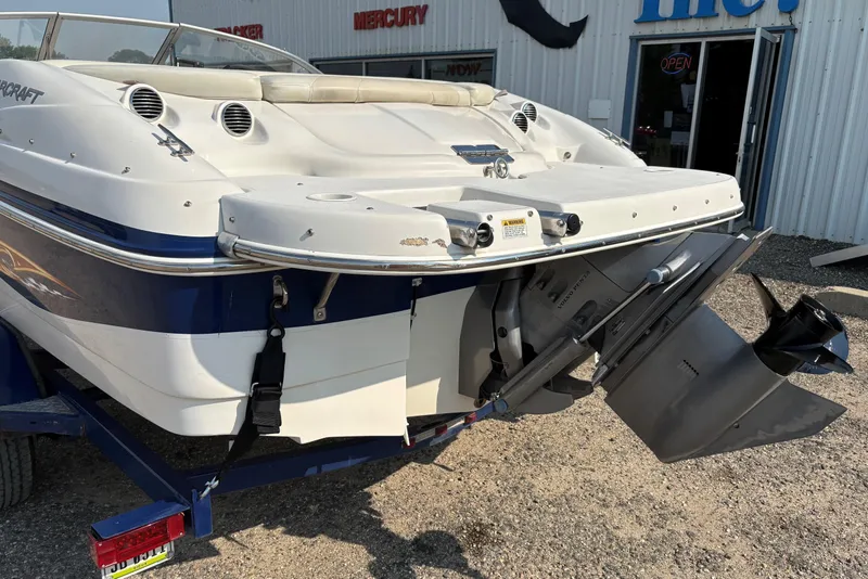 Slide: The Image of 2006 Starcraft C-Star 1800 I/O boat, rear view with outboard motor, parked on trailer. - 5