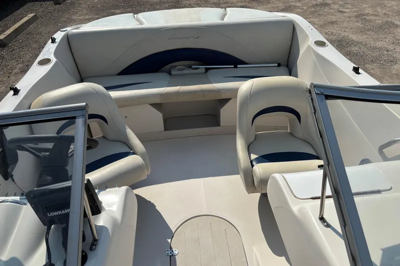 Slide: The Image of 2006 Starcraft C-Star 1800 I/O boat interior with white and blue seating. - 9
