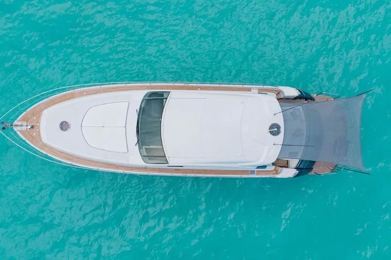 Slide: The Image of Aerial view of 2007 Pershing 62 yacht on turquoise water. - 2