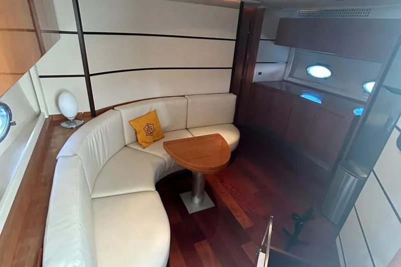 Slide: The Image of Luxurious interior of 2007 Pershing 62 yacht with white leather seating and wooden accents. - 3