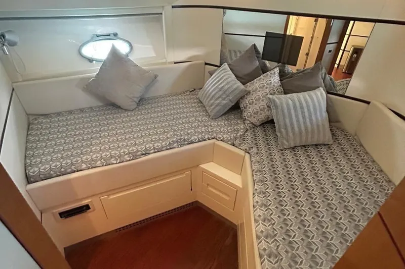 Slide: The Image of Luxurious cabin interior of a 2007 Pershing 62 yacht with stylish bedding and cushions. - 5