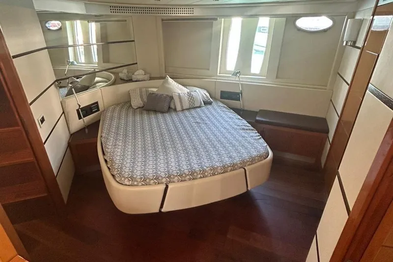 Slide: The Image of Luxurious bedroom interior of 2007 Pershing 62 yacht with elegant bedding and wood flooring. - 6