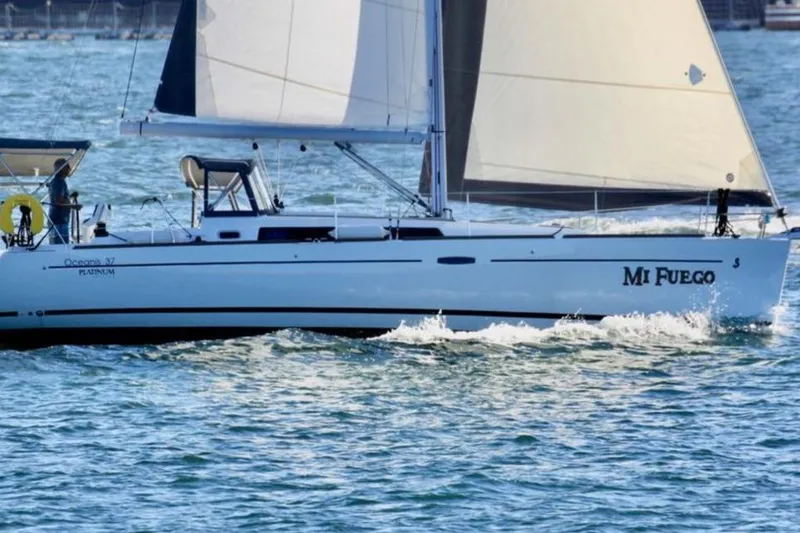 The Image of 2017 Beneteau Oceanis 37 sailboat "Mi Fuego" cruising on the water. - 0
