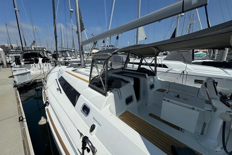 Slide: The Image of 2017 Beneteau Oceanis 37 sailboat docked at marina, showcasing sleek design and spacious deck. - 10
