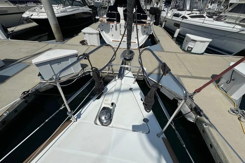 Slide: The Image of Bow view of a 2017 Beneteau Oceanis 37 yacht docked at a marina. - 12