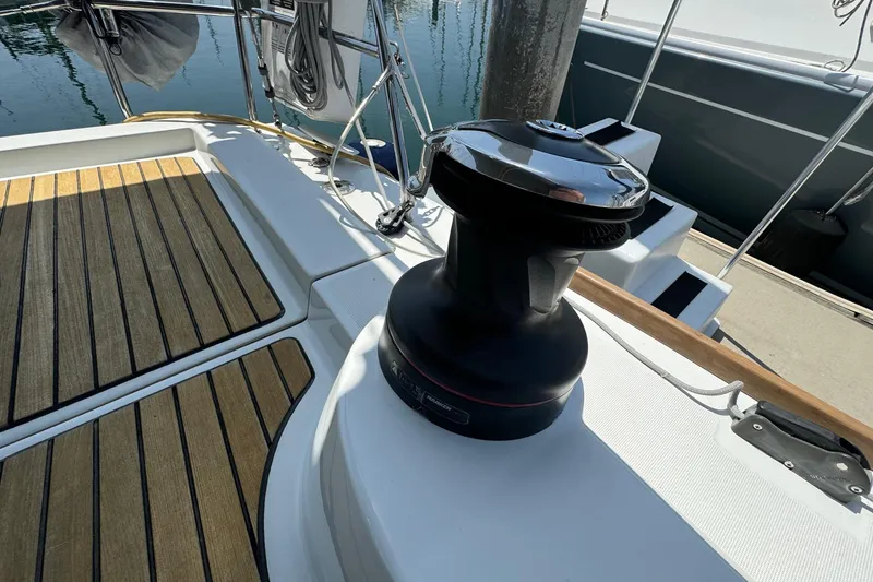 Slide: The Image of Beneteau Oceanis 37 sailboat deck with winch, 2017 model, featuring teak flooring. - 15
