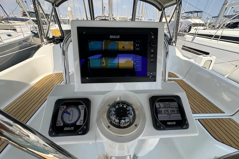 Slide: The Image of Cockpit of 2017 Beneteau Oceanis 37 sailboat with navigation instruments and compass. - 17