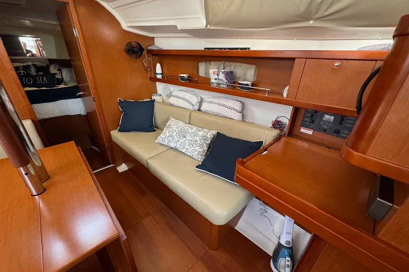 Slide: The Image of Interior of 2017 Beneteau Oceanis 37 sailboat with cozy seating and wooden finishes. - 26