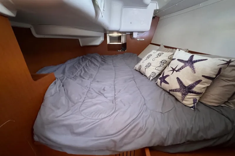 Slide: The Image of Cozy cabin interior of 2017 Beneteau Oceanis 37 with starfish-themed pillows. - 31