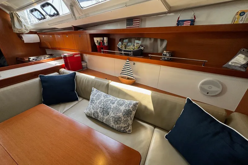 Slide: The Image of Interior of 2017 Beneteau Oceanis 37 yacht with cozy seating and nautical decor. - 32