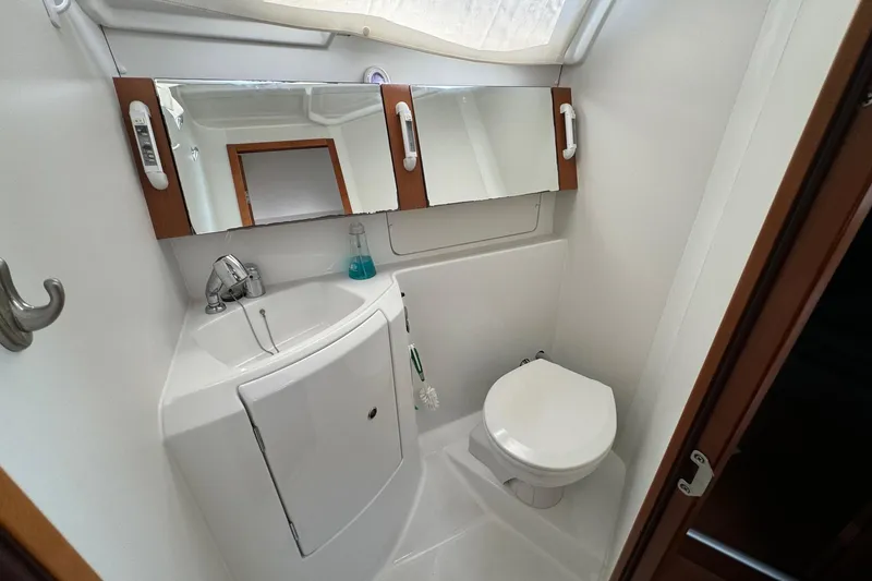 Slide: The Image of Bathroom interior of 2017 Beneteau Oceanis 37 yacht, featuring sink, mirror, and toilet. - 33
