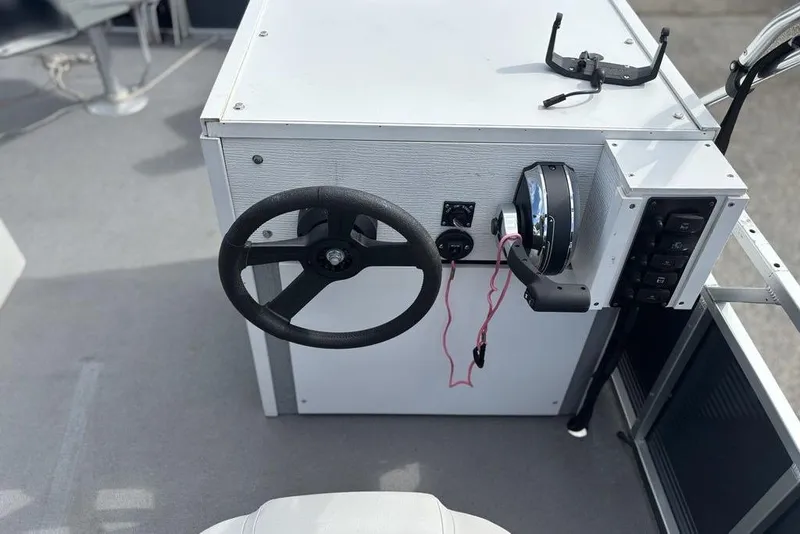 Slide: The Image of Steering console of 2020 Apex Gillgetter 7515 Tiller boat with controls and switches. - 11