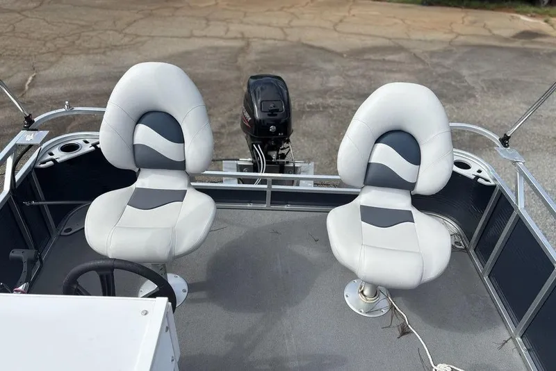 Slide: The Image of 2020 Apex Gillgetter 7515 Tiller boat interior with two cushioned seats and motor. - 13