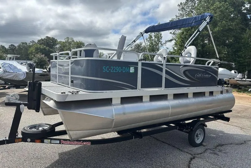 Slide: The Image of 2020 Apex Gillgetter 7515 Tiller pontoon boat on trailer, parked outdoors. - 2