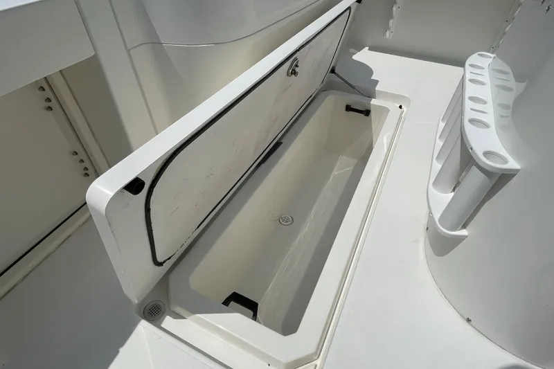 Slide: The Image of Open storage compartment on 2005 Rampage 33 Express boat deck. - 10