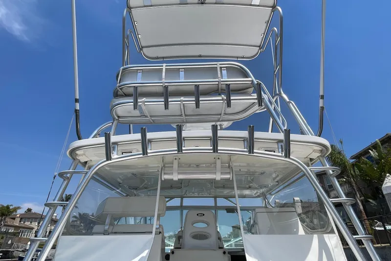Slide: The Image of 2005 Rampage 33 Express boat with tower and seating, under clear blue sky. - 12