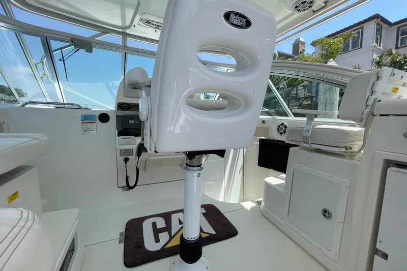 Slide: The Image of 2005 Rampage 33 Express boat interior with captain's chair and control panel. - 28