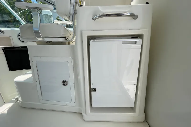 Slide: The Image of 2005 Rampage 33 Express boat interior with seating and storage compartments. - 29