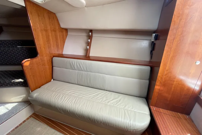 Slide: The Image of 2005 Rampage 33 Express interior with beige leather seating and wooden accents. - 37