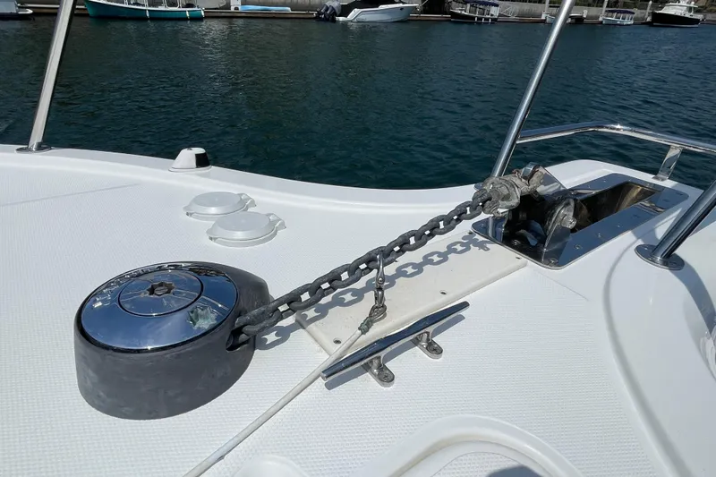 Slide: The Image of 2005 Rampage 33 Express boat anchor chain and winch on deck. - 49
