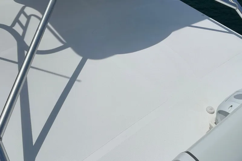 Slide: The Image of 2005 Rampage 33 Express boat deck with shadows and railing details. - 54