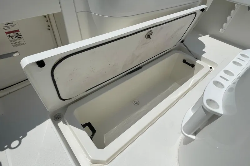 Slide: The Image of Open storage compartment on 2005 Rampage 33 Express boat deck. - 9