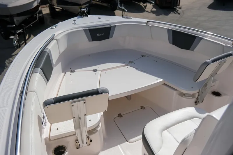 Slide: The Image of 2023 Robalo R230 Center Console boat interior with seating and storage. - 13