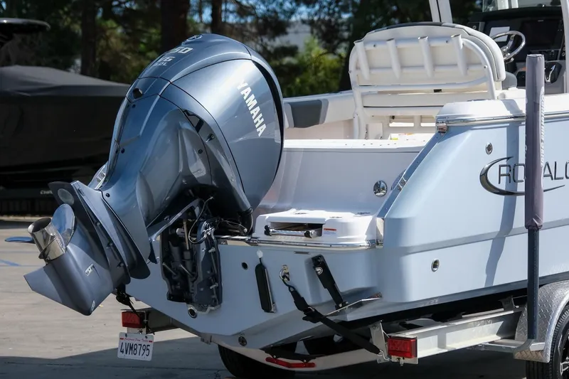Slide: The Image of 2023 Robalo R230 Center Console boat with Yamaha outboard motor, parked on trailer. - 6