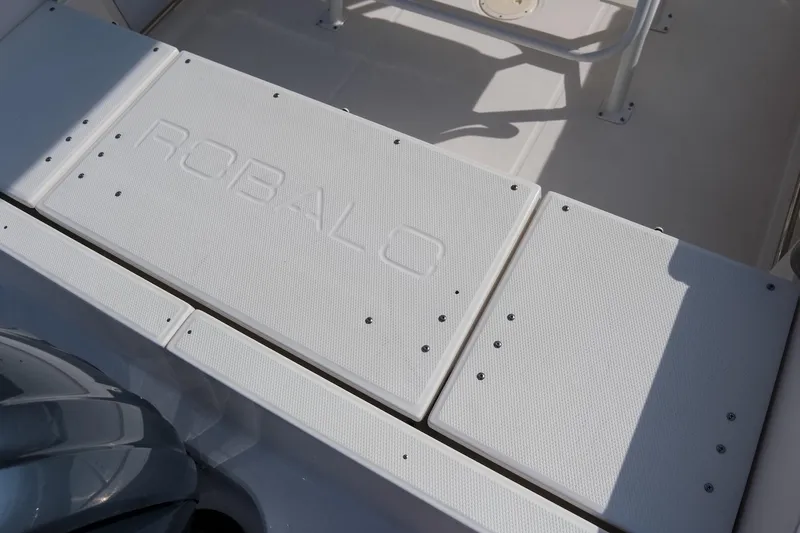 Slide: The Image of 2023 Robalo R230 Center Console boat deck with embossed logo. - 9
