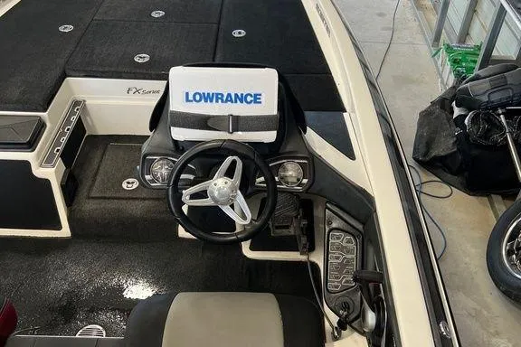 Slide: The Image of 2014 Skeeter FX 21 boat interior with Lowrance electronics and steering wheel. - 4