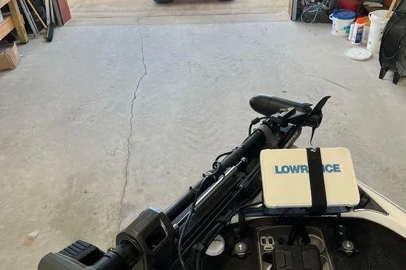 Slide: The Image of 2014 Skeeter FX 21 boat with Lowrance equipment in a garage setting. - 5