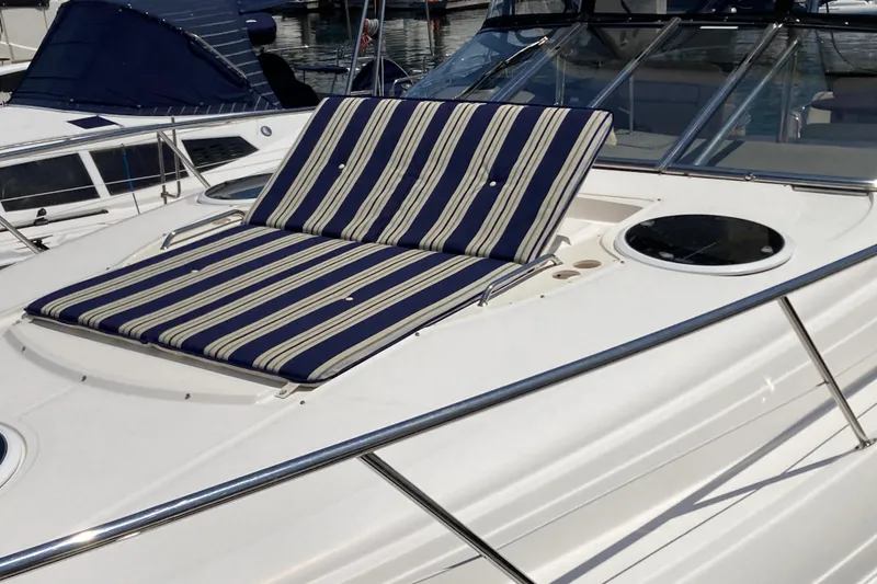 Slide: The Image of 2010 Regal 4460 Monterrey yacht with striped sunbed on deck. - 12