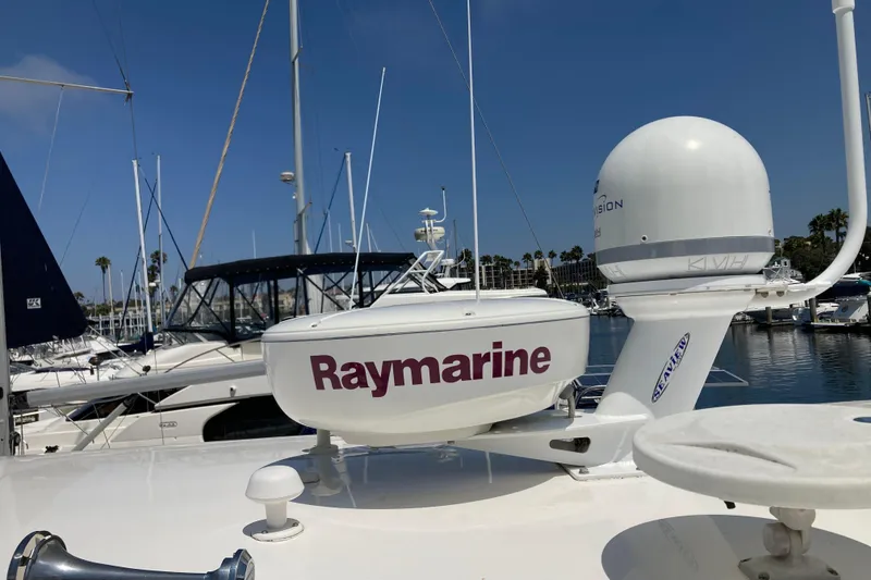 Slide: The Image of 2010 Regal 4460 Monterrey yacht with Raymarine equipment at marina. - 13