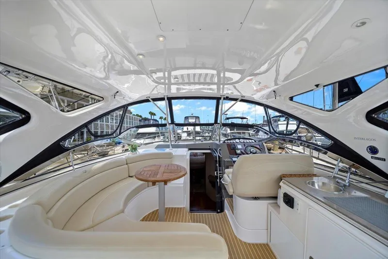 Slide: The Image of Interior of 2010 Regal Commodore 4460 yacht with luxurious seating and modern helm. - 15