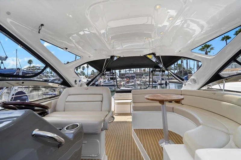 Slide: The Image of Luxurious interior of 2010 Regal Commodore 4460 yacht with seating and table. - 20