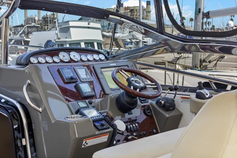 Slide: The Image of Cockpit of 2010 Regal Commodore 4460 yacht with modern navigation instruments. - 22