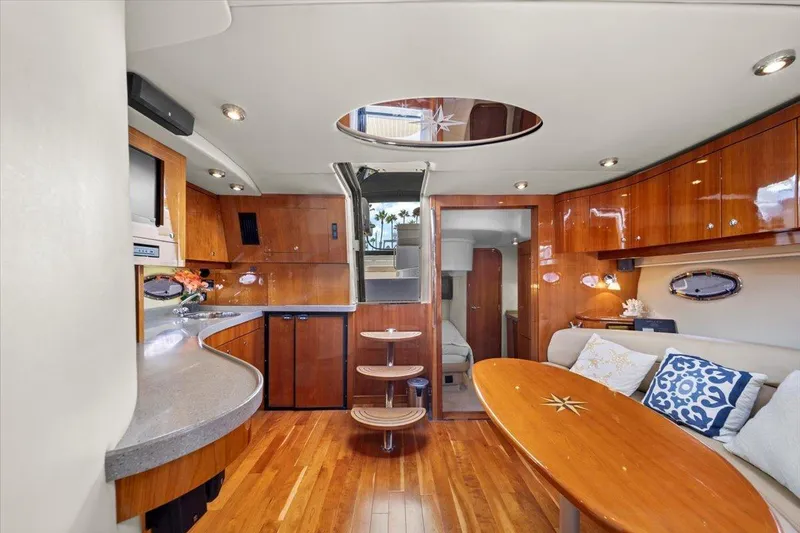 Slide: The Image of Luxurious interior of 2010 Regal Commodore 4460 yacht with wood finishes and modern amenities. - 25